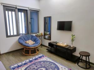 TV in/ali zabaviščno središče v nastanitvi Kon-Tiki DaNang Hostel