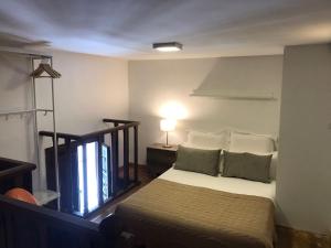 A bed or beds in a room at Embrujo