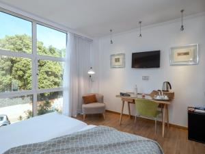 Postel nebo postele na pokoji v ubytování Vilana Hotel Boutique + 37 fotografií