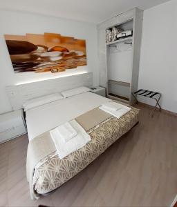 Posteľ alebo postele v izbe v ubytovaní Hostal Kokkola