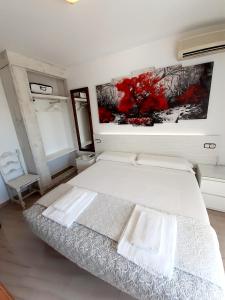 Posteľ alebo postele v izbe v ubytovaní Hostal Kokkola