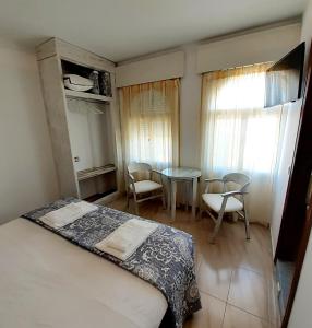 Posteľ alebo postele v izbe v ubytovaní Hostal Kokkola