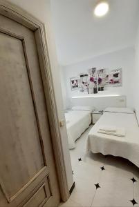 Posteľ alebo postele v izbe v ubytovaní Hostal Kokkola