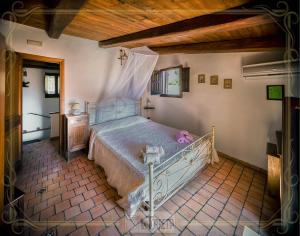 Postel nebo postele na pokoji v ubytování B&B La Torretta
