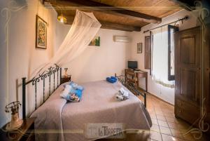 Postel nebo postele na pokoji v ubytování B&B La Torretta