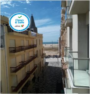 a view of the beach from the balcony of a building at Casa Picadeiro in Figueira da Foz