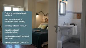 敘拉古的住宿－Casa VerbaVolant，一间带水槽和卫生间的浴室以及一张床