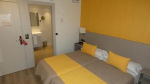 Postel nebo postele na pokoji v ubytování Hotel Zeus