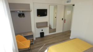 TV a/nebo společenská místnost v ubytování Hotel Zeus