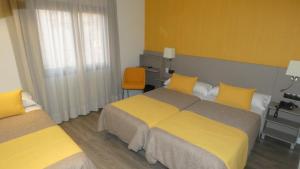 Postel nebo postele na pokoji v ubytování Hotel Zeus