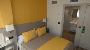 Postel nebo postele na pokoji v ubytování Hotel Zeus
