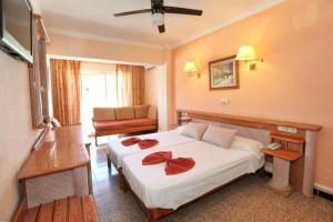Łóżko lub łóżka w pokoju w obiekcie Hotel Manaus