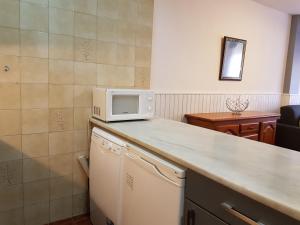 Kuchyň nebo kuchyňský kout v ubytování Apartamentos Grifovacances Consuegra 1
