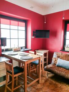a living room with a table and a couch at Cinnamon villa in Palanga