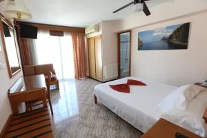 Łóżko lub łóżka w pokoju w obiekcie Hotel Manaus