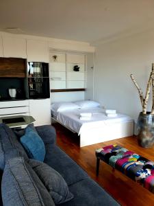 Кровать или кровати в номере Apartment Polonia