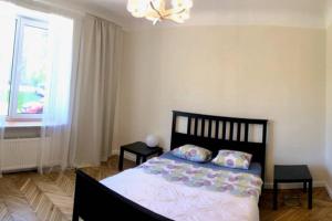 A bed or beds in a room at New comfortable apartment nearby promenade in 5 minutes from Old town of Riga.