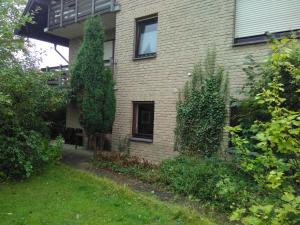 a brick house with a window on the side of it at Ferienwohnung am Mozarthügel in Warstein