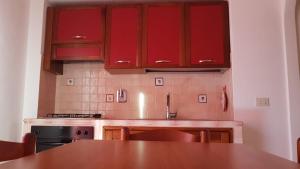 Kuchyň nebo kuchyňský kout v ubytování ANFORA Rosso