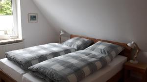 Un ou plusieurs lits dans un hébergement de l'établissement Ferienhaus Gartenstraße