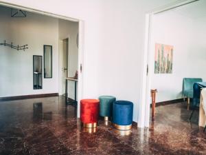 a room with colorfulools on the floor in a room at Explore Greece from Colorful City Centre Apartment in Chalkida