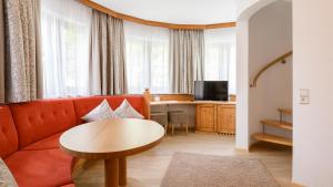 Televízia a/alebo spoločenská miestnosť v ubytovaní Hotel Garni Castel B&B