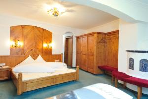Posteľ alebo postele v izbe v ubytovaní Hotel Garni Castel B&B