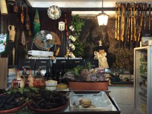 a store with a bunch of vegetables on a counter at Prestige Apartment in Amarante
