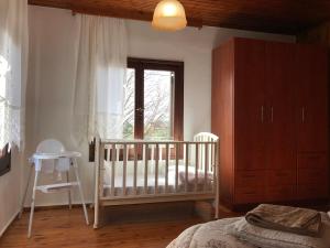 A bed or beds in a room at Sarakinas Farm House