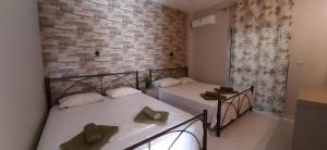 Postel nebo postele na pokoji v ubytování SEA VIEW APARTMENTS Artemis