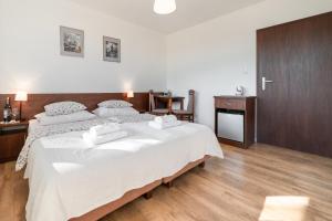 Postel nebo postele na pokoji v ubytování Na zoloju