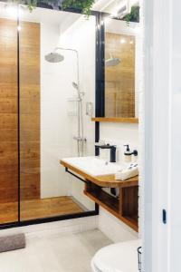 a bathroom with a sink and a shower at Cozy39 in Kaliningrad