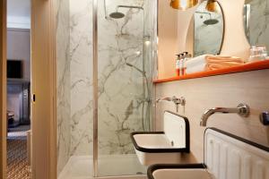 a bathroom with a sink and a shower at Bike & Boot Inns Scarborough - Leisure Hotels for Now in Scarborough +109 photos