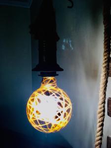 a glass light bulb hanging from a pole at Pillows Peniche B&B in Peniche