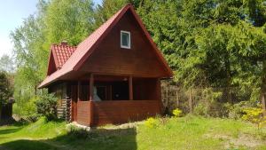 a small house with a red roof at Zacisze in Kukle