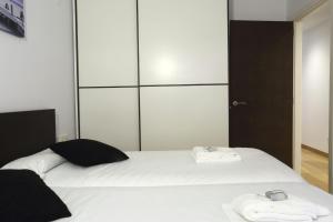 Łóżko lub łóżka w pokoju w obiekcie Bakea by Smiling Rentals