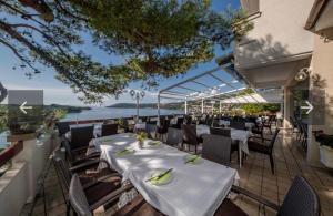 a restaurant with a table with bananas on it at Belveder Deluxe Suite and Rooms in Supetarska Draga