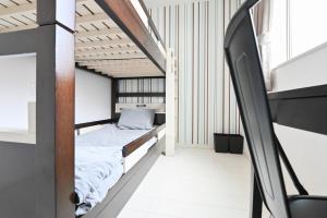 Postel nebo postele na pokoji v ubytování RUMa INN Rokugoudote