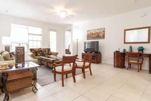 a living room with a couch and a table at 3 BR 3 BA Apartment 5min to Universal 1823sqft in Orlando