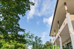 a building with the sky in the background at Kebun Villas & Resort in Senggigi