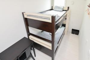 Postel nebo postele na pokoji v ubytování RUMa INN Rokugoudote