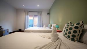 Un pat sau paturi într-o cameră la Resort V - MRT Huai Khwang +45 fotografii