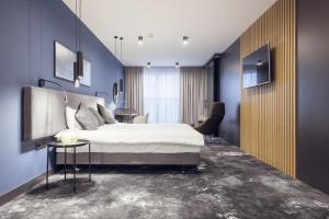 Ένα ή περισσότερα κρεβάτια σε δωμάτιο στο Mamaison Residence Diana