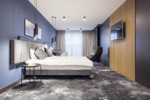 Posteľ alebo postele v izbe v ubytovaní Mamaison Residence Diana