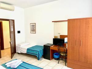 Posteľ alebo postele v izbe v ubytovaní Hotel Alessander