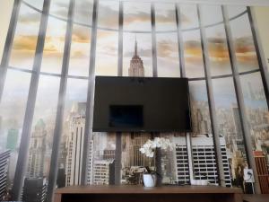 a large window with a view of a city at Szent Miklós Apartman in Hajdúszoboszló