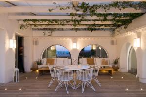 a dining room with a table and chairs at Villa Brisa del Mar Seafront villa located in the Garraf National Park 30 minutes from Barcelona in Sant Pere de Ribes