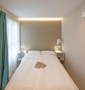 Кровать или кровати в номере La Lonja
