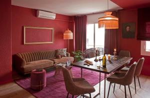 a living room with a table and a couch at Isabella's House in Barcelona