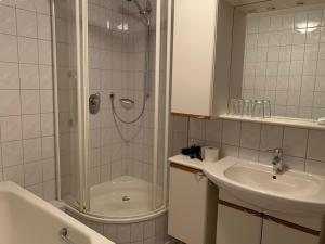 a bathroom with a shower and a sink at Landgasthof Ochsen in Seelbach